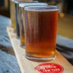 Freshly poured amber beer served in a glass on a coaster
