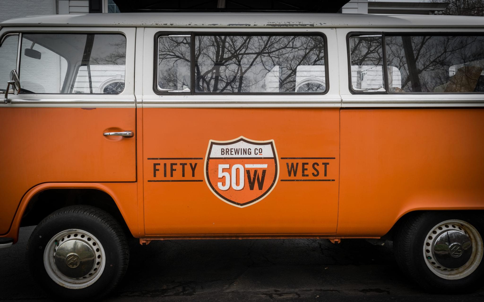Orange vintage van with brewery logo