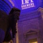 Brewery entrance illuminated with blue lighting at night