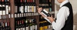 liquor display with a person holding the bottle